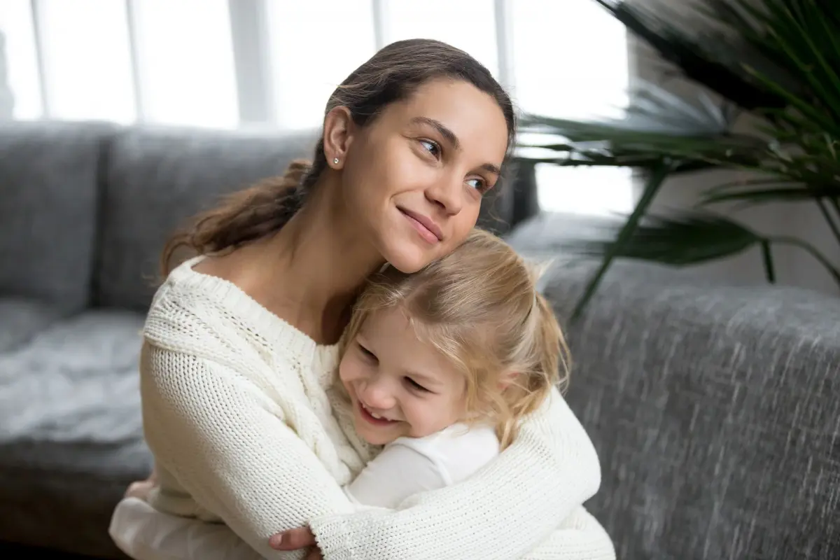 Mother and daughter hugging